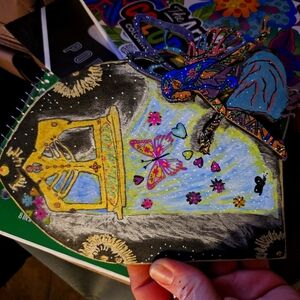 Hand made fairy sitting by a window